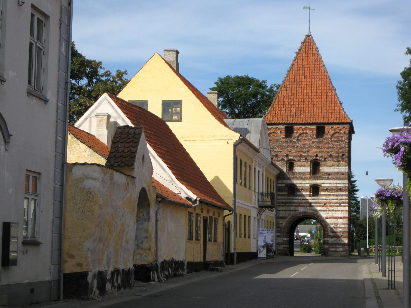 Storegade in Stege on Møn with the medieval town gate Mølleporten
